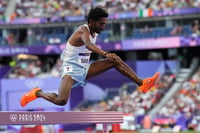 | Photo: AP/Petr David Josek : Avinash Mukund Sable competes in the men's 3000-meter steeplechase heat